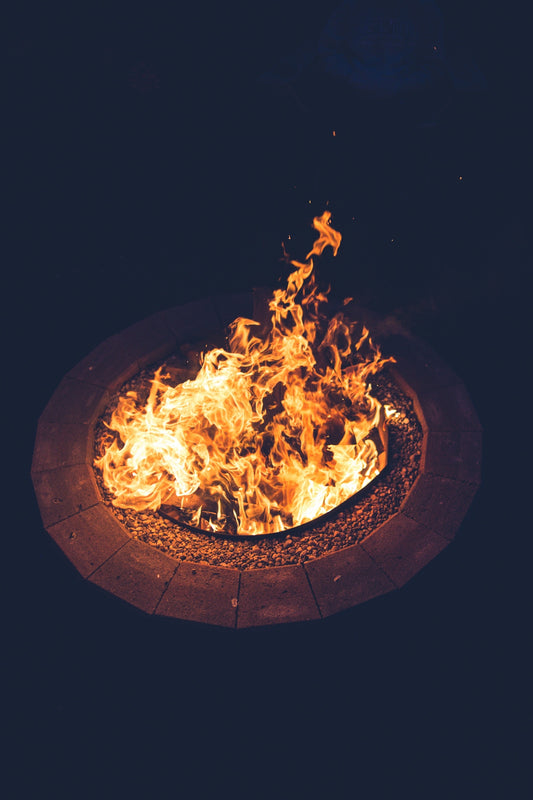 fire in black round fire pit
