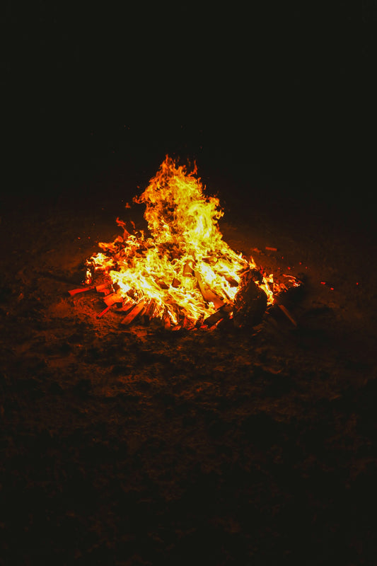 A fire is lit up in the dark