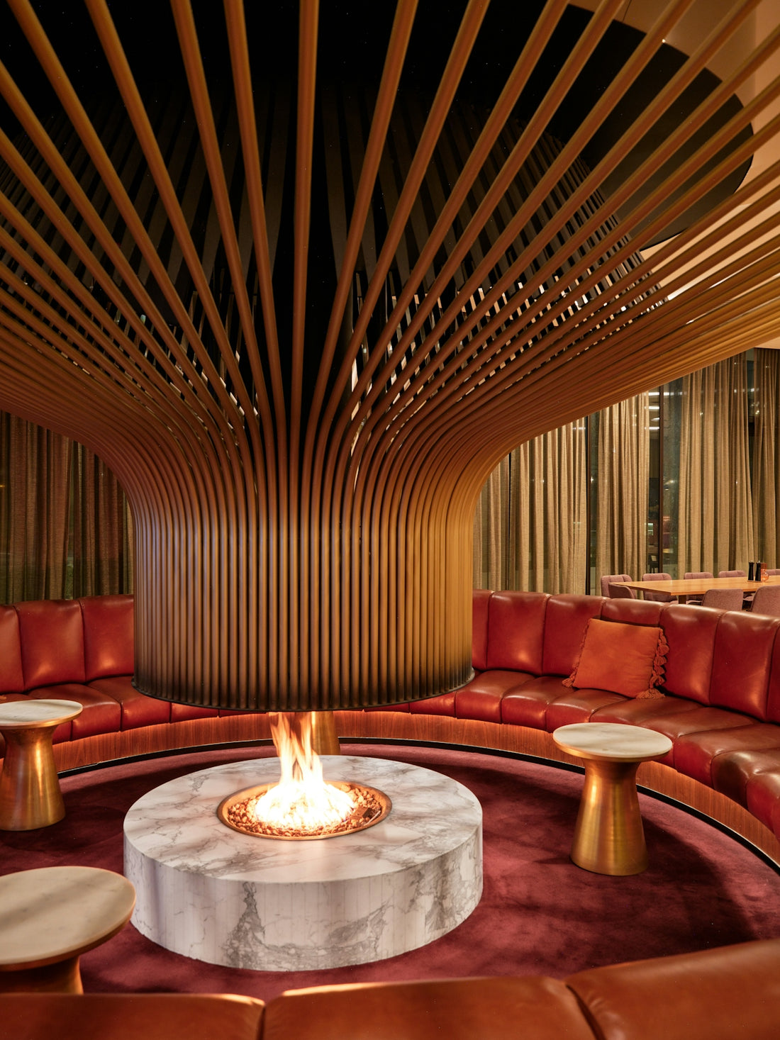 Circular lounge with modern fireplace and wood ceiling